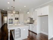 White Cabinets with Custom Decorator Design at Provence by Waterford Homes at Regency Point